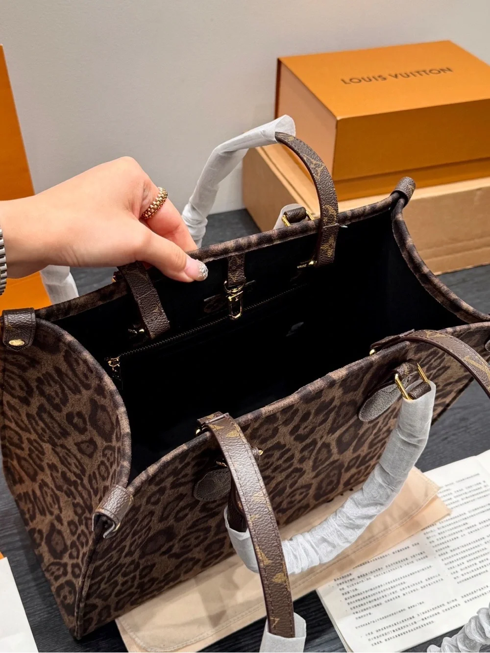 Louis Vuitton Leopard-Print Tote in Brown